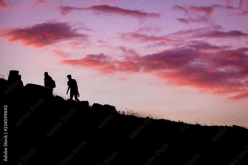 Silhouette of Hikers at Red Sunset