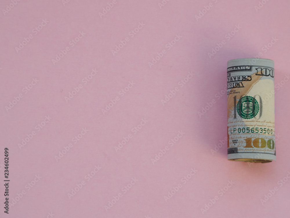 roll of american dollars isolated on pink background roll of american dollars isolated on pink background
