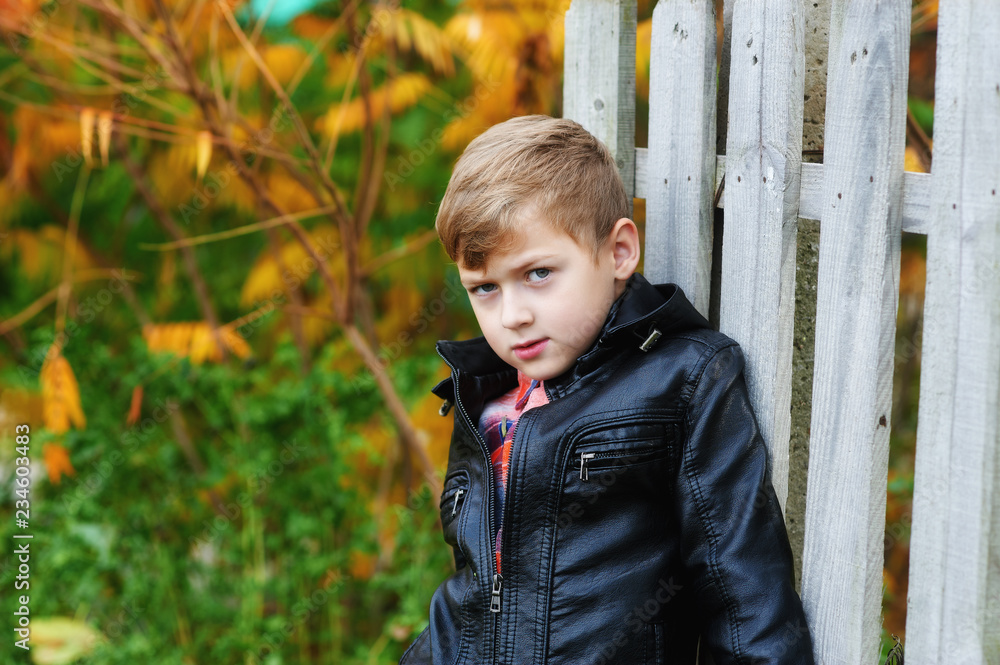 Portrait of boy in black leather jacket for Stock-foto | Adobe Stock