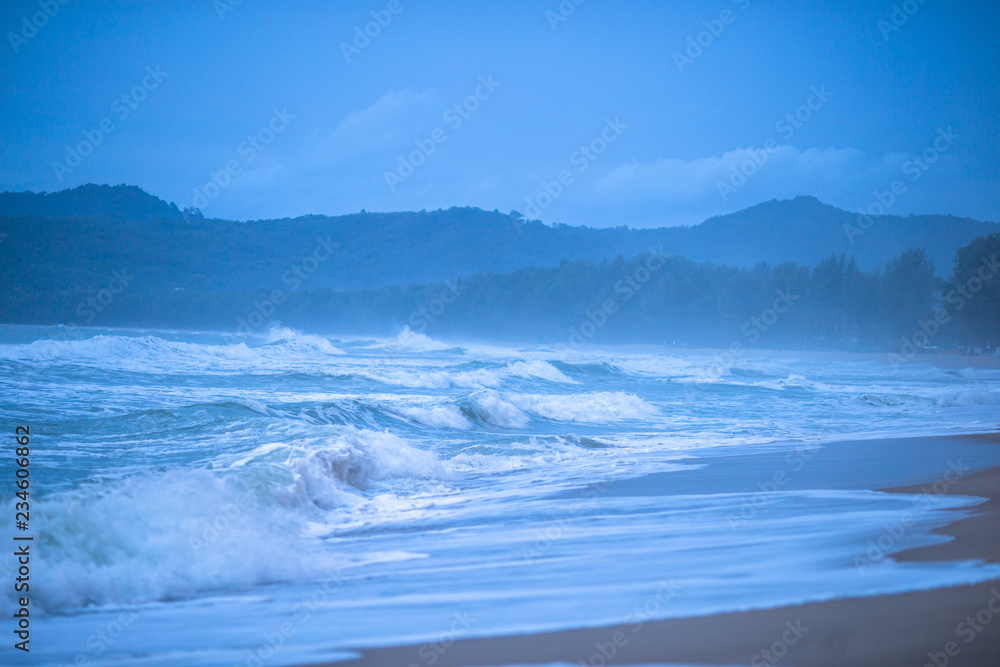 The background of the sea, with strong wind waves, storm wallpaper, caused by seasonal weather changes, and small boats should be taken off shore.