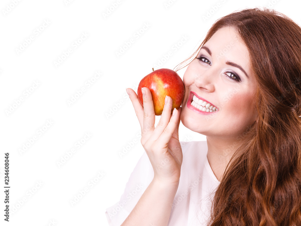Woman holds apple fruit close to face, isolated Woman holds apple fruit close to face, isolated