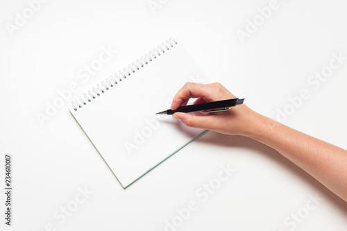 Blank memo pad note with pen close up