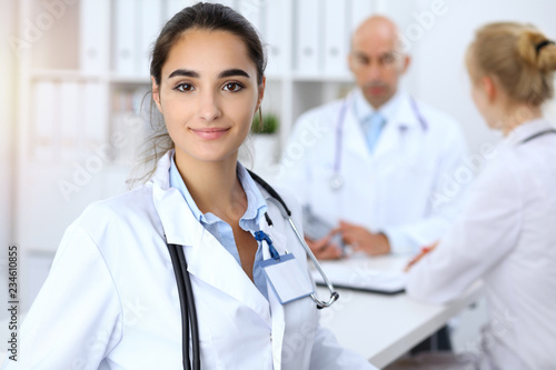Portrait of young doctor woman  in hospital. Hispanic or latin american staff in medicine