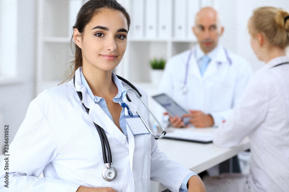 Portrait of young doctor woman in hospital. Hispanic or latin american staff in medicine Portrait of young doctor woman in hospital. Hispanic or latin american staff in medicine