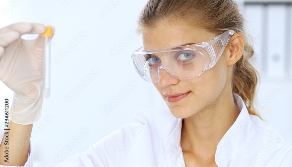 Female scientific researcher or blood test assistant in laboratory. Medicine concept Female scientific researcher or blood test assistant in laboratory. Medicine concept