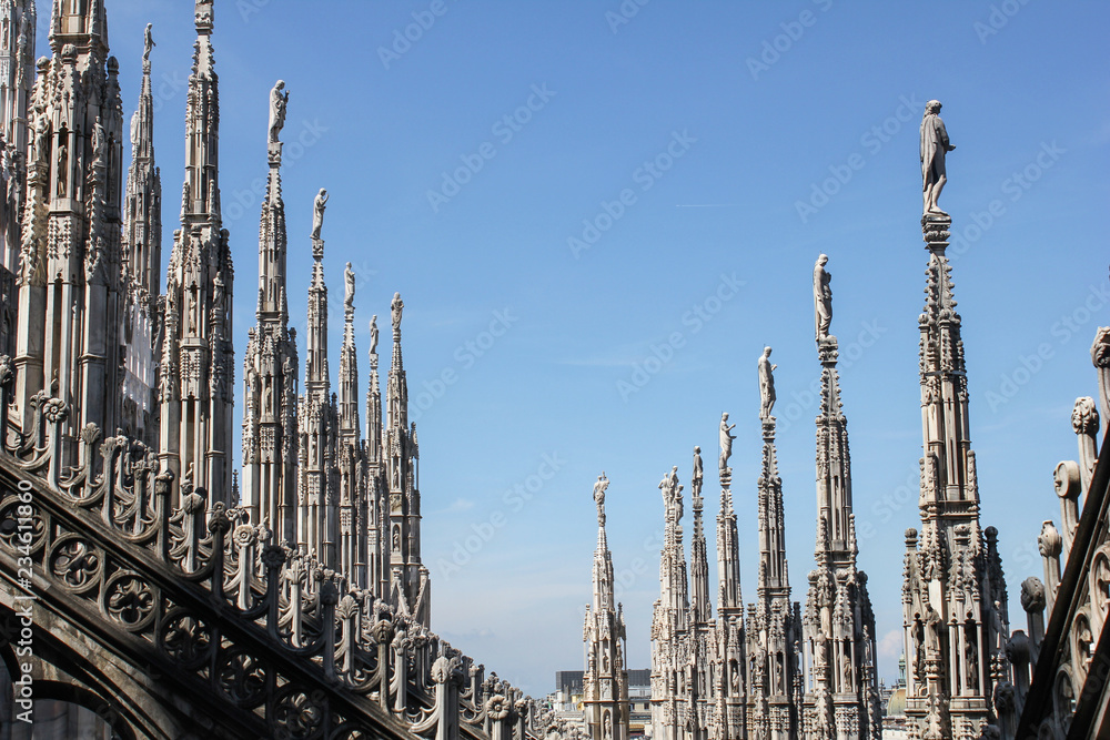 Stone patterns./ Stone carved spires of the cathedral rush into the sky
