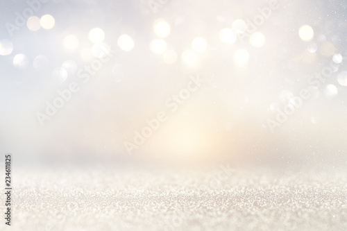 glitter vintage lights background. silver and light gold de-focused. © tomertu