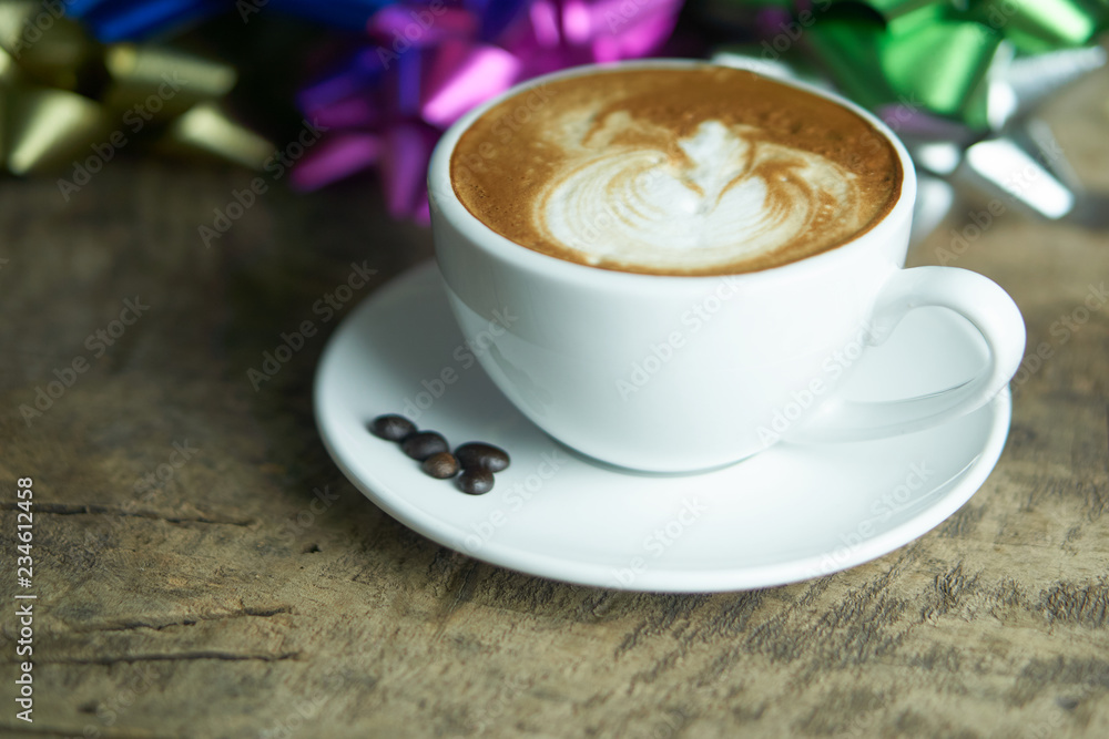Cappuccino and latte art on the wood table. Free hand pouring some milk on the coffee. Morning breakfast with coffee. Cappuccino and latte art on the wood table. Free hand pouring some milk on the coffee. Morning breakfast with coffee.