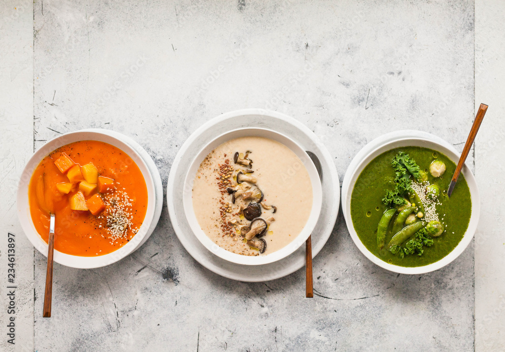 Group of cream soup bowls Plant based food three cream vegetable soup bowl overhead Group of cream soup bowls Plant based food three cream vegetable soup bowl overhead