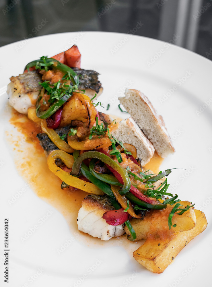 caldeirada traditional portuguese sea bream fish and vegetable spicy stew in gourmet restaurant