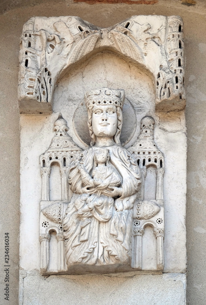 Enthroned Madonna, portal of Santa Maria Forisportam church in Lucca, Tuscany, Italy