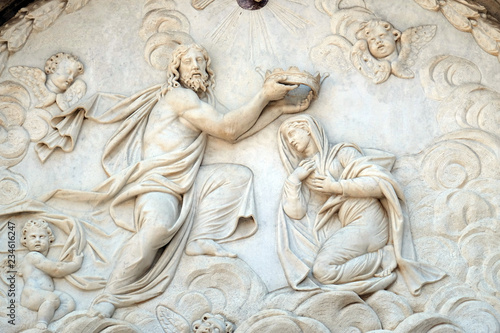 Coronation of the Virgin Mary, portal of Santa Maria Forisportam church in Lucca, Tuscany, Italy photo