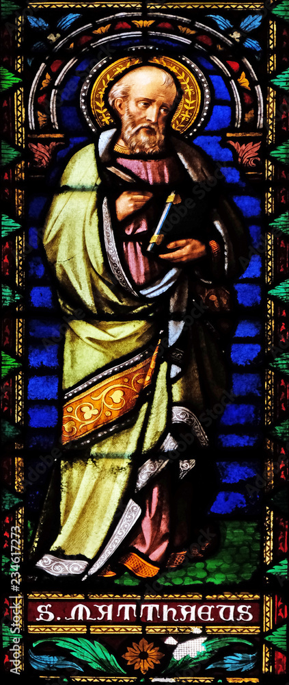Saint Matthew the Evangelist, stained glass window in the San Michele in Foro church in Lucca, Tuscany, Italy Saint Matthew the Evangelist, stained glass window in the San Michele in Foro church in Lucca, Tuscany, Italy