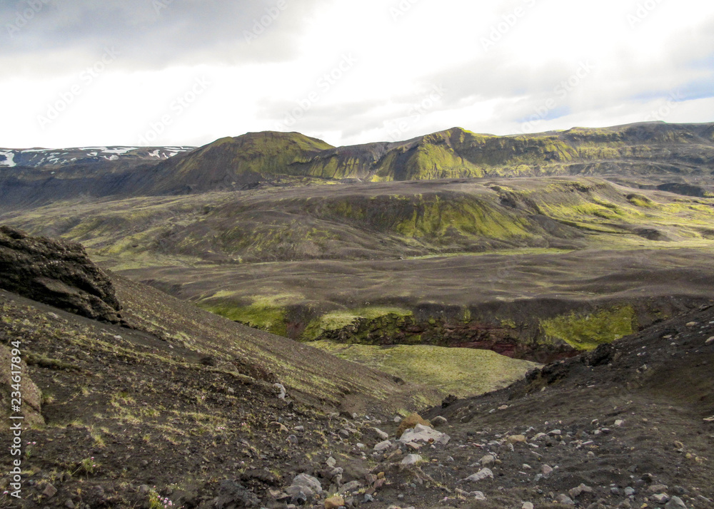 Dramatic icelandic terrain with volcanoes, canyons, glacial rivers, highland deserts and poor vegetation, on the Laugavegur Trail, Highlands of Iceland