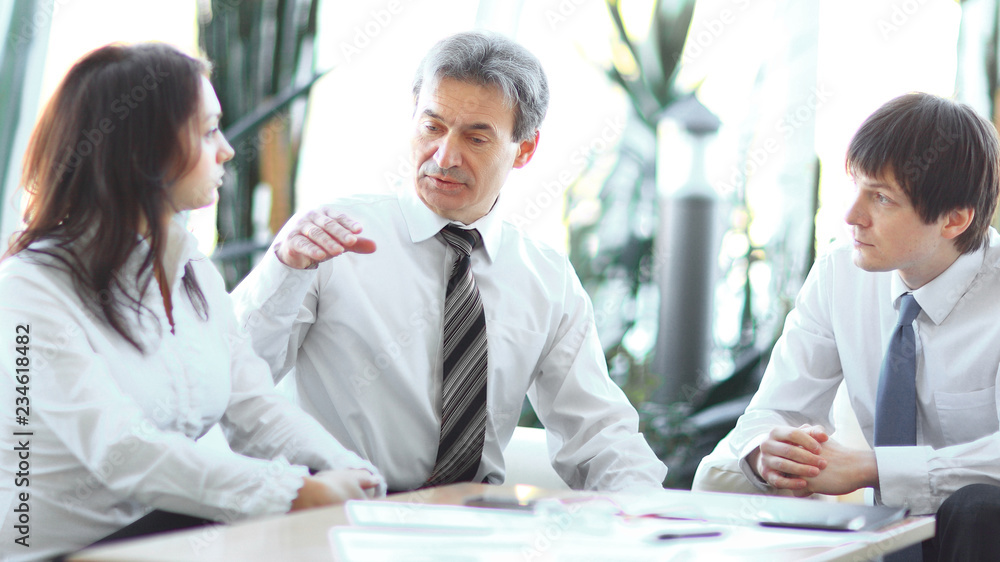 project leader talking to business team in the workplace.