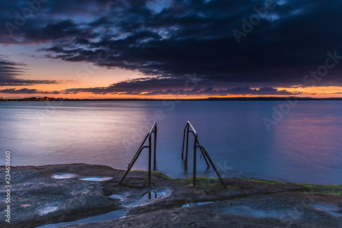 Purple and Orange Dawn Waterscape over the Lake photo