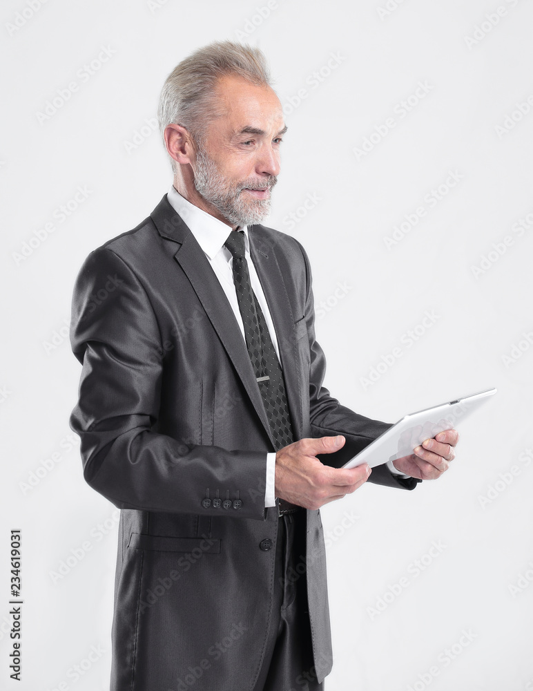 modern businessman reading text on a digital tablet.isolated on grey background modern businessman reading text on a digital tablet.isolated on grey background