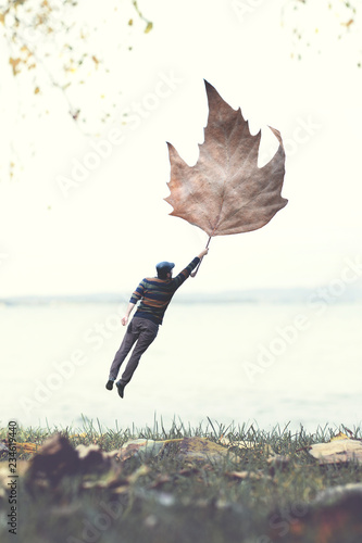 man flying with a big leaf 