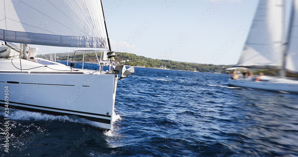 Fototapeta premium Luxury yachts at Sailing regatta. Sailing in the wind through the Sea.
