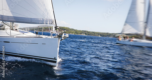 Luxury yachts at Sailing regatta. Sailing in the wind through the Sea. © NDABCREATIVITY