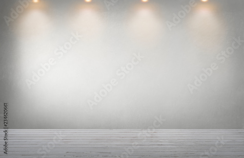 Gray wall with a row of spotlights in an empty room