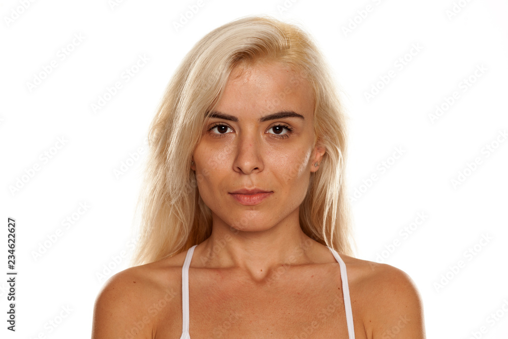 Portrait of young beautiful blonde woman with no makeup on white backgeound Portrait of young beautiful blonde woman with no makeup on white backgeound
