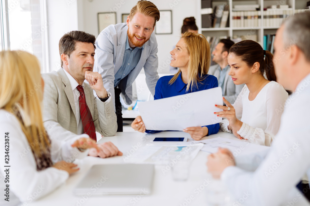 Group of business people working as team in office Group of business people working as team in office