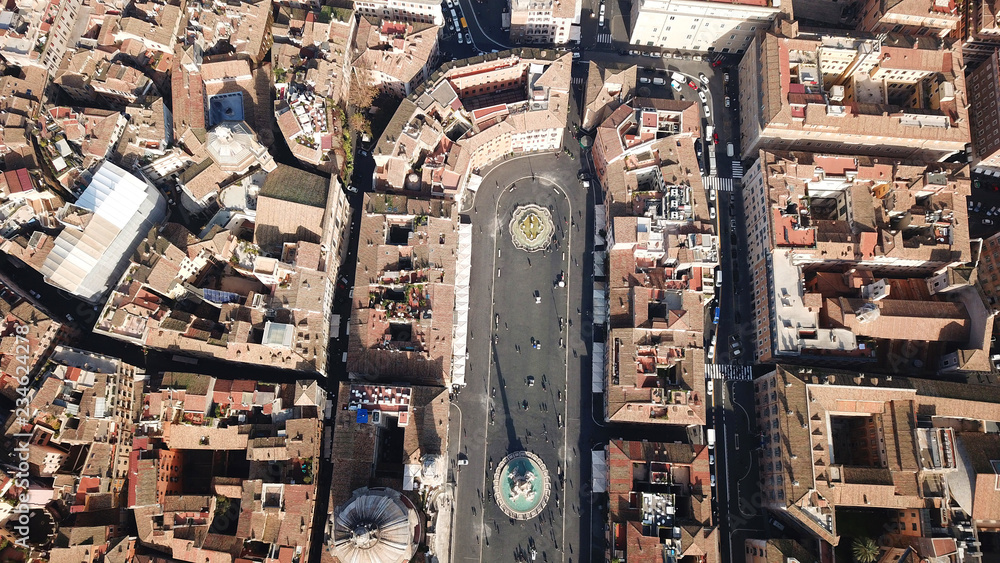 Aerial drone view of iconic landmark Piazza Navona Square featuring Fountain of the Four Rivers with an Egyptian obelisk and Sant Agnese Church in the heart of Rome, Italy