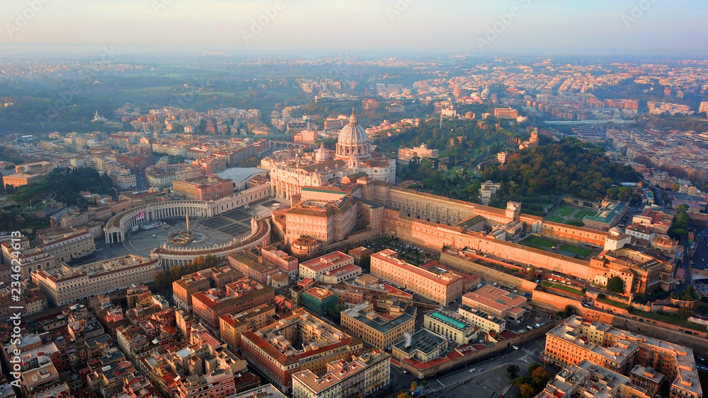 Aerial drone view of Saint Peter's square in front of world's largest church - Papal Basilica of St. Peter's, Vatican - an elliptical esplanade created in the mid seventeenth century, Rome, Italy
