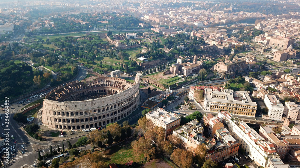 Aerial drone view of iconic ancient Arena of Colosseum, also known as the Flavian amphitheatre in the heart of Rome, Italy