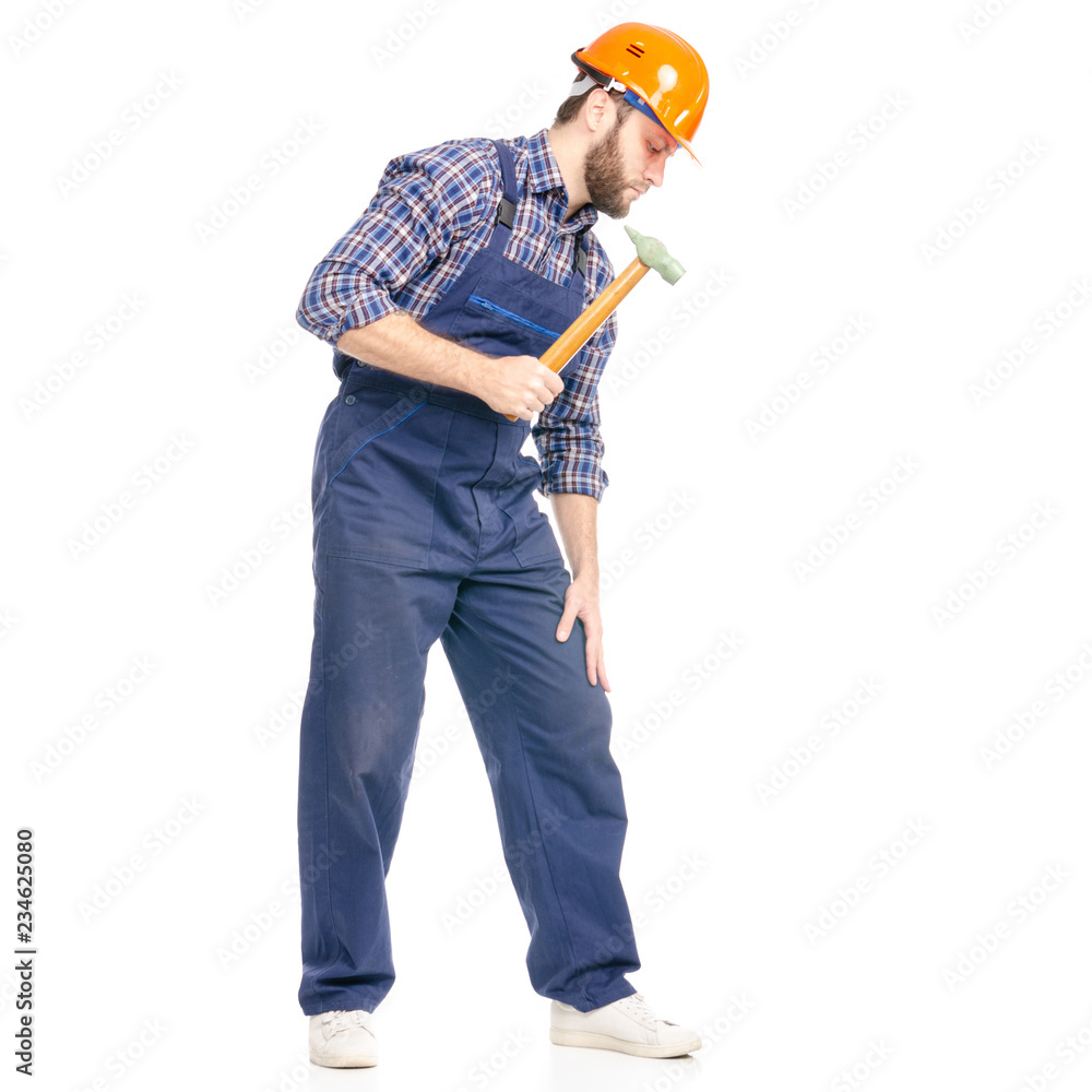 Young man builder industry worker hardhat with a hammer on white background isolation Young man builder industry worker hardhat with a hammer on white background isolation