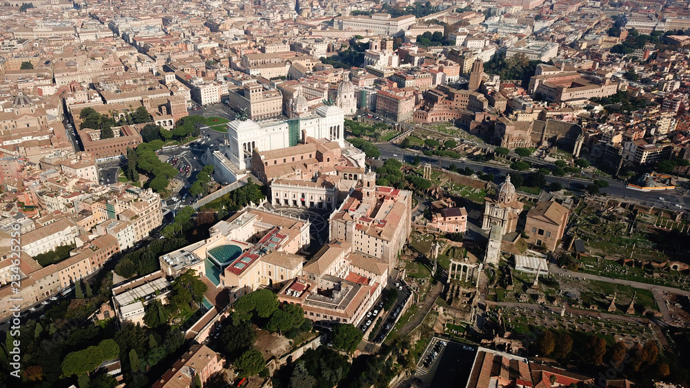 Aerial drone view from Roman Forum one of the main tourist attractions which was build in ancient times as the site of triumphal processions and elections next to Colosseum, Rome, Italy
