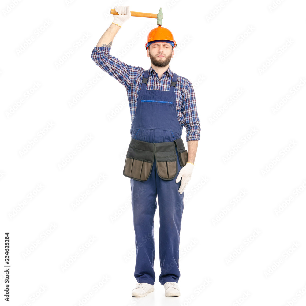 Young man builder industry worker with a hammer on white background isolation Young man builder industry worker with a hammer on white background isolation