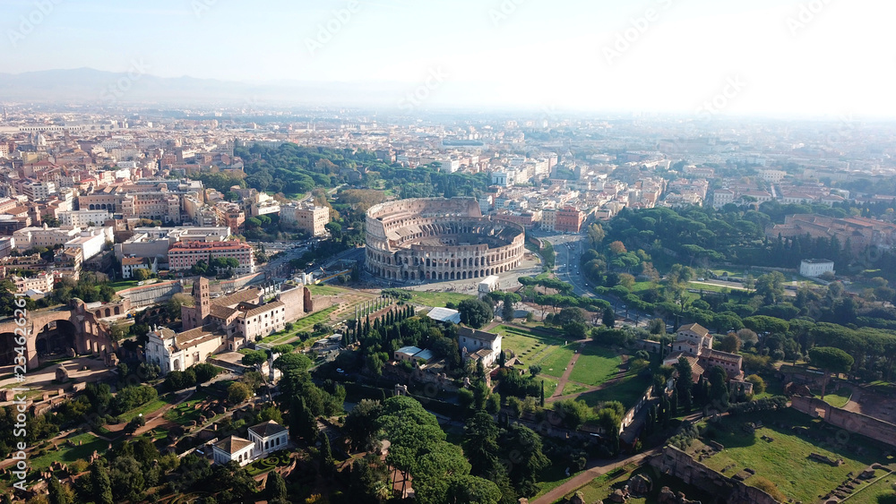 Aerial drone view of iconic ancient Arena of Colosseum, also known as the Flavian amphitheatre in the heart of Rome, Italy