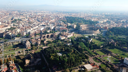 Aerial drone view from Roman Forum one of the main tourist attractions which was build in ancient times as the site of triumphal processions and elections next to Colosseum, Rome, Italy