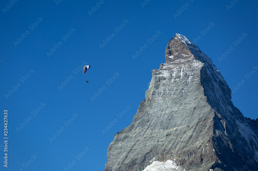 Parapenter flying near the famous Matterhorn in Zermatt, Switzerland. Parapenter flying near the famous Matterhorn in Zermatt, Switzerland.