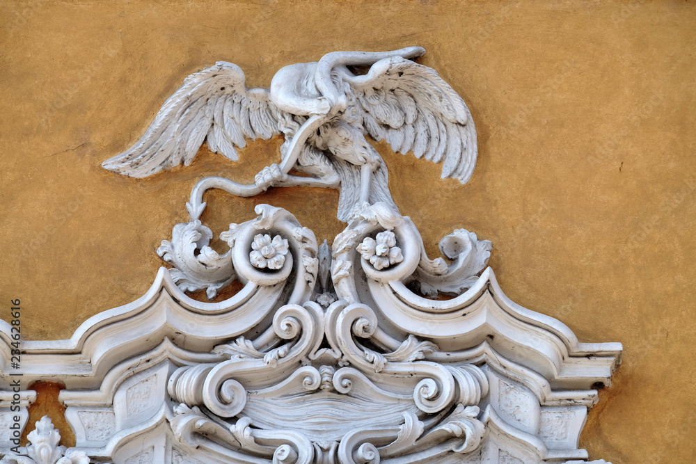 Beautiful house facade with carved stone animals in Mantua, Italy 