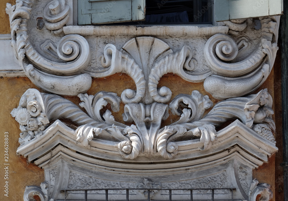 Beautiful house facade with carved stone in Mantua, Italy Beautiful house facade with carved stone in Mantua, Italy