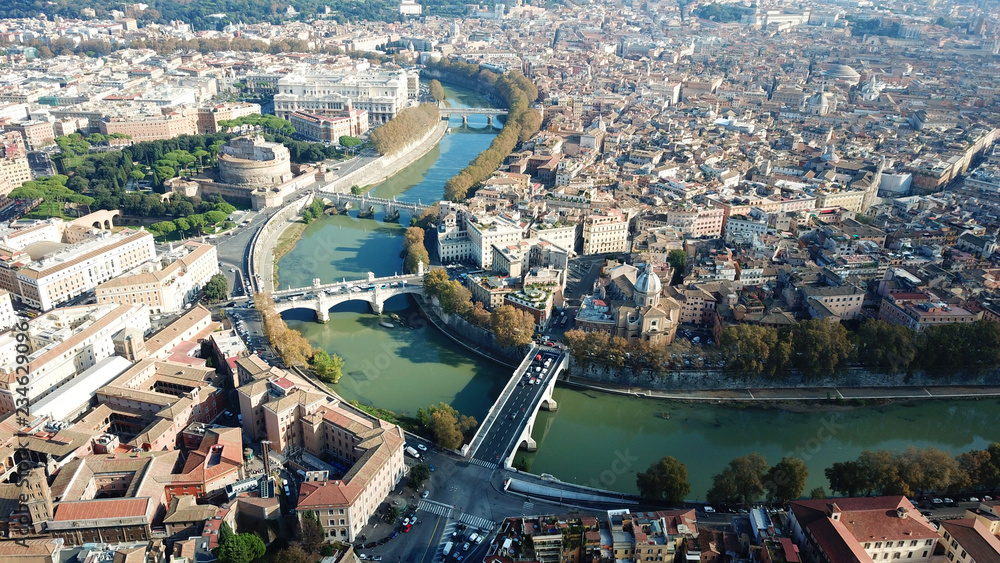 Obraz premium Aerial drone view of iconic Castel Sant' Angelo (castle of Holy Angel) and Ponte or bridge Sant'Angelo with statues in river of Tiber next to famous Vatican, Rome, Italy