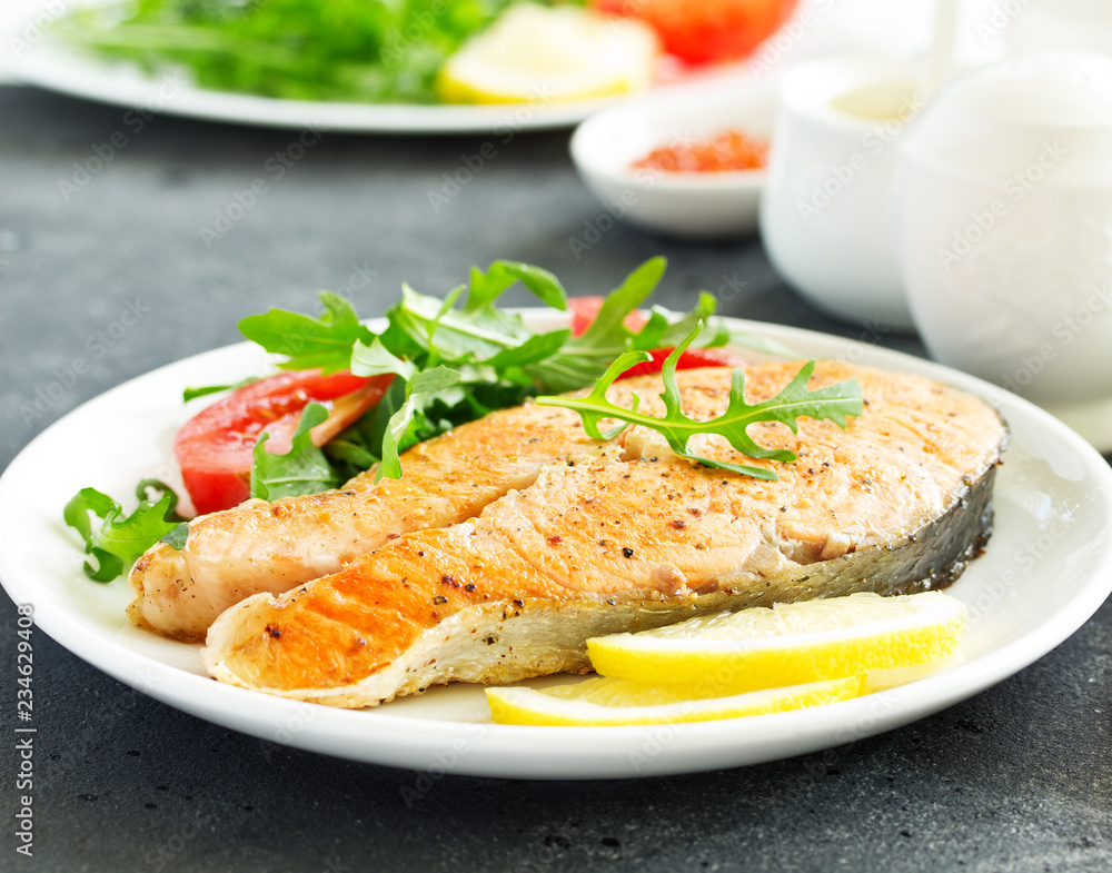 grilled salmon steak with cream sauce. grilled salmon steak with cream sauce.