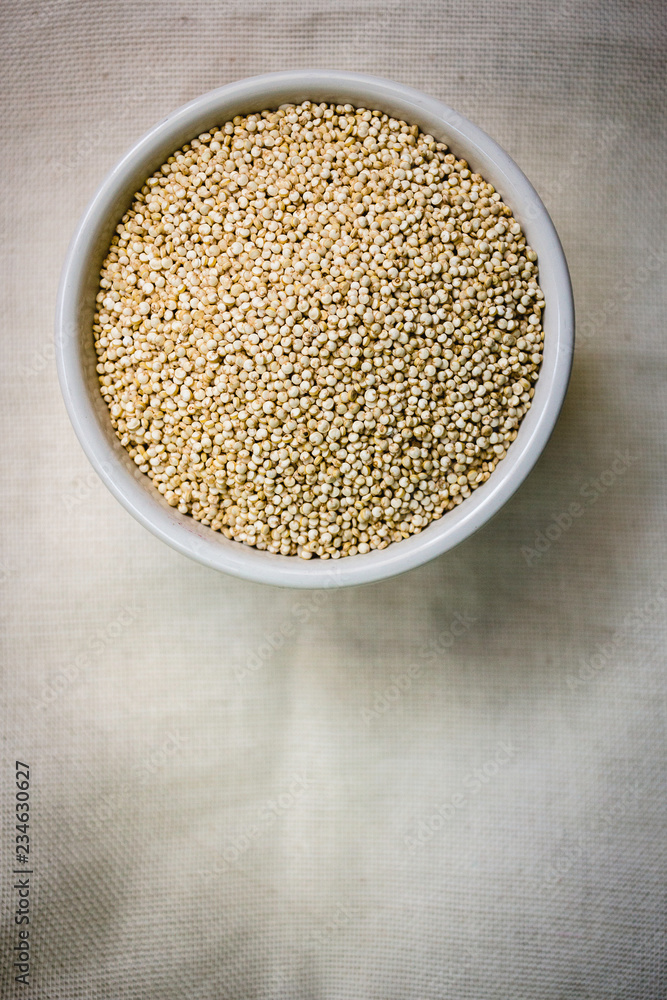 Quinoa in white cup. Raw white quinoa Quinoa in white cup. Raw white quinoa