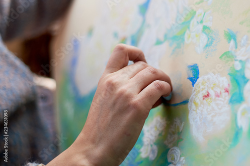 Canvas Print The artist paints with dry pastel