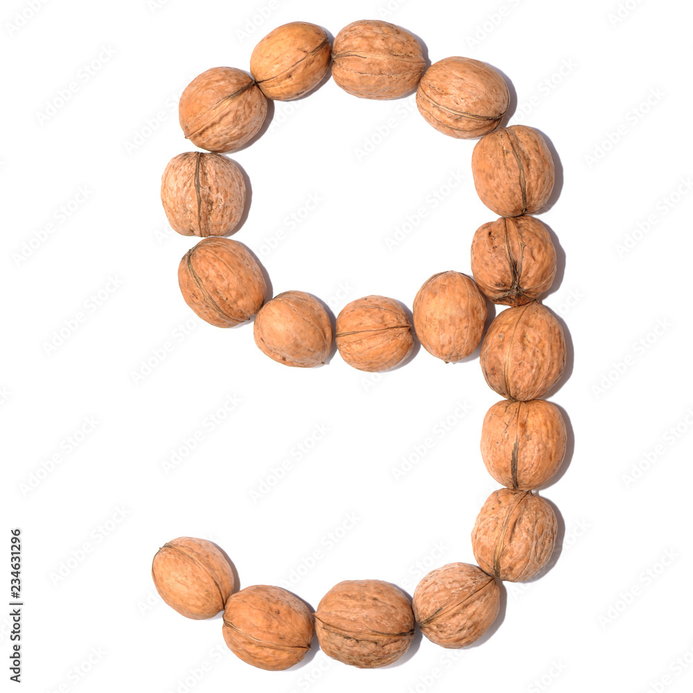Number nine. Figure composed of nuts on a white isolated background. Number nine. Figure composed of nuts on a white isolated background.