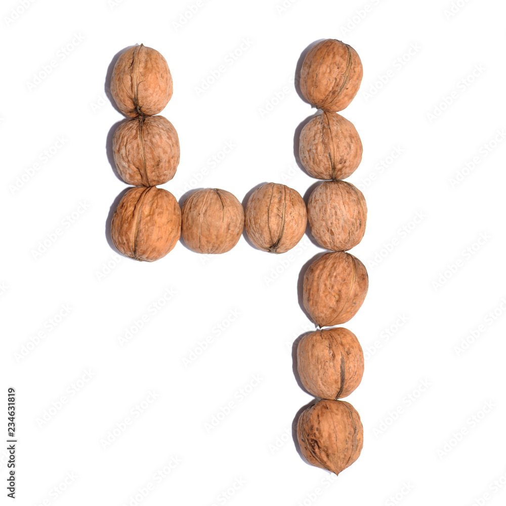 Number four. Figure composed of nuts on a white isolated background. Number four. Figure composed of nuts on a white isolated background.