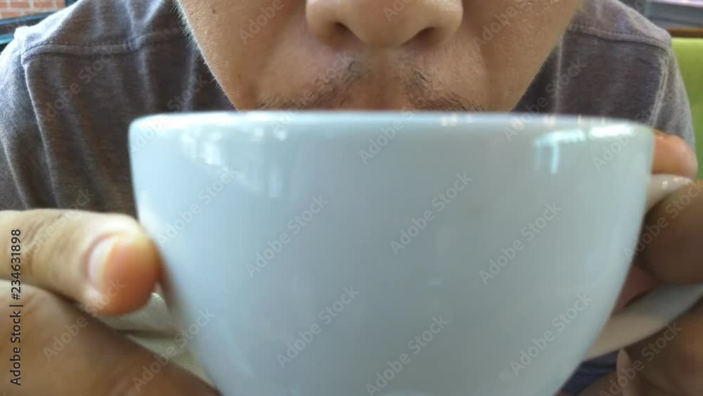 Close up mouth drinking coffee and smiling while sitting at the cafe. Close up mouth drinking coffee and smiling while sitting at the cafe.