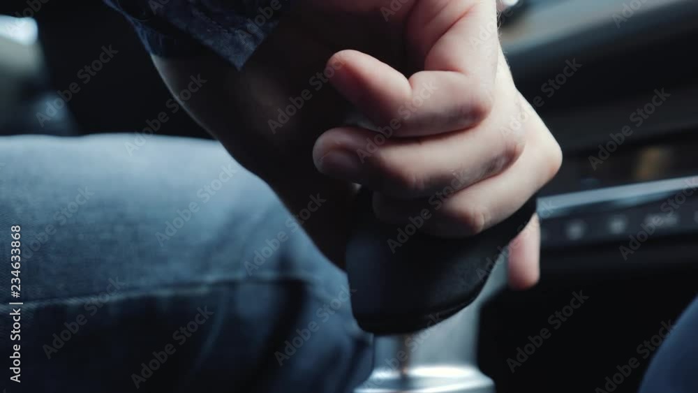 The driver switches the manual transmission in the car The driver switches the manual transmission in the car