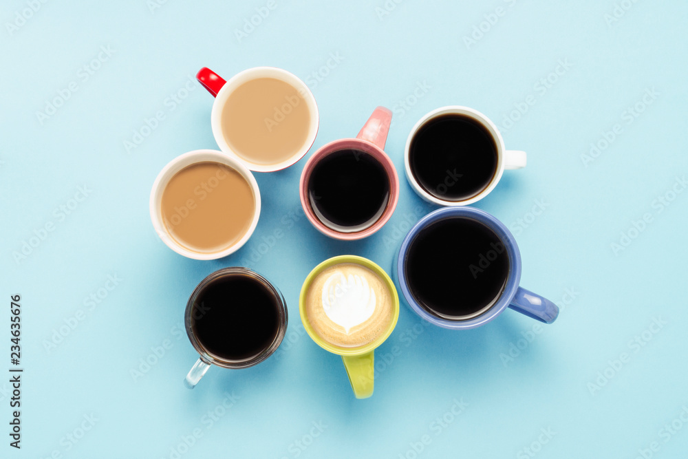 Many multicolored cups of coffee and coffee drinks on a blue background. Concept breakfast with coffee, coffee with friends. Flat lay, top view Many multicolored cups of coffee and coffee drinks on a blue background. Concept breakfast with coffee, coffee with friends. Flat lay, top view