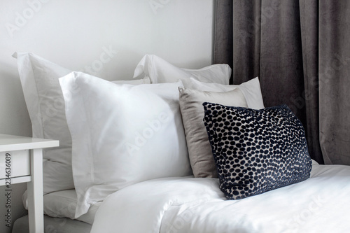 hotel bed down comforter feather pillows photo