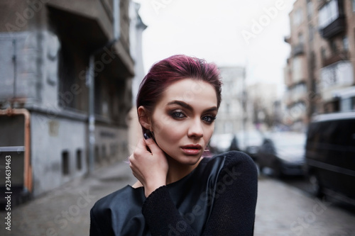 Portrait of girl outside with violet hair © Maksym