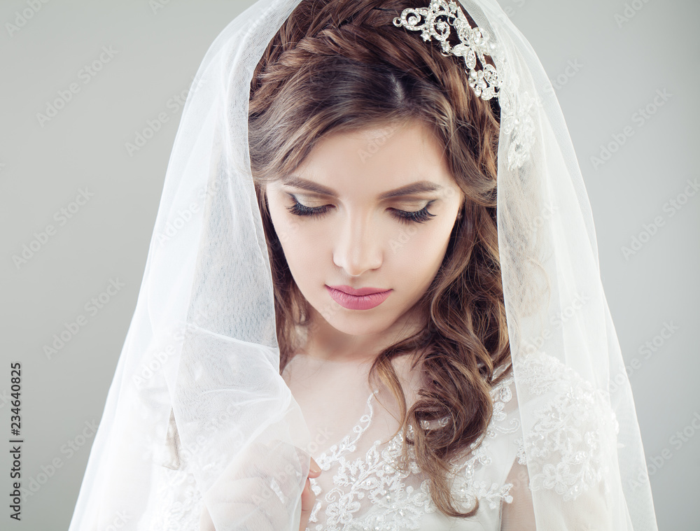 Beautiful bride woman in veil, face closeup female portrait Beautiful bride woman in veil, face closeup female portrait